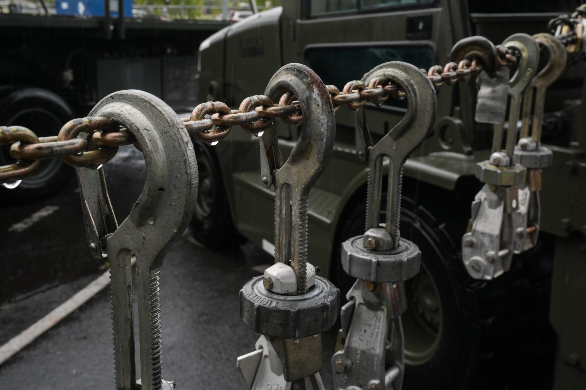 Hooks hang on a chain.