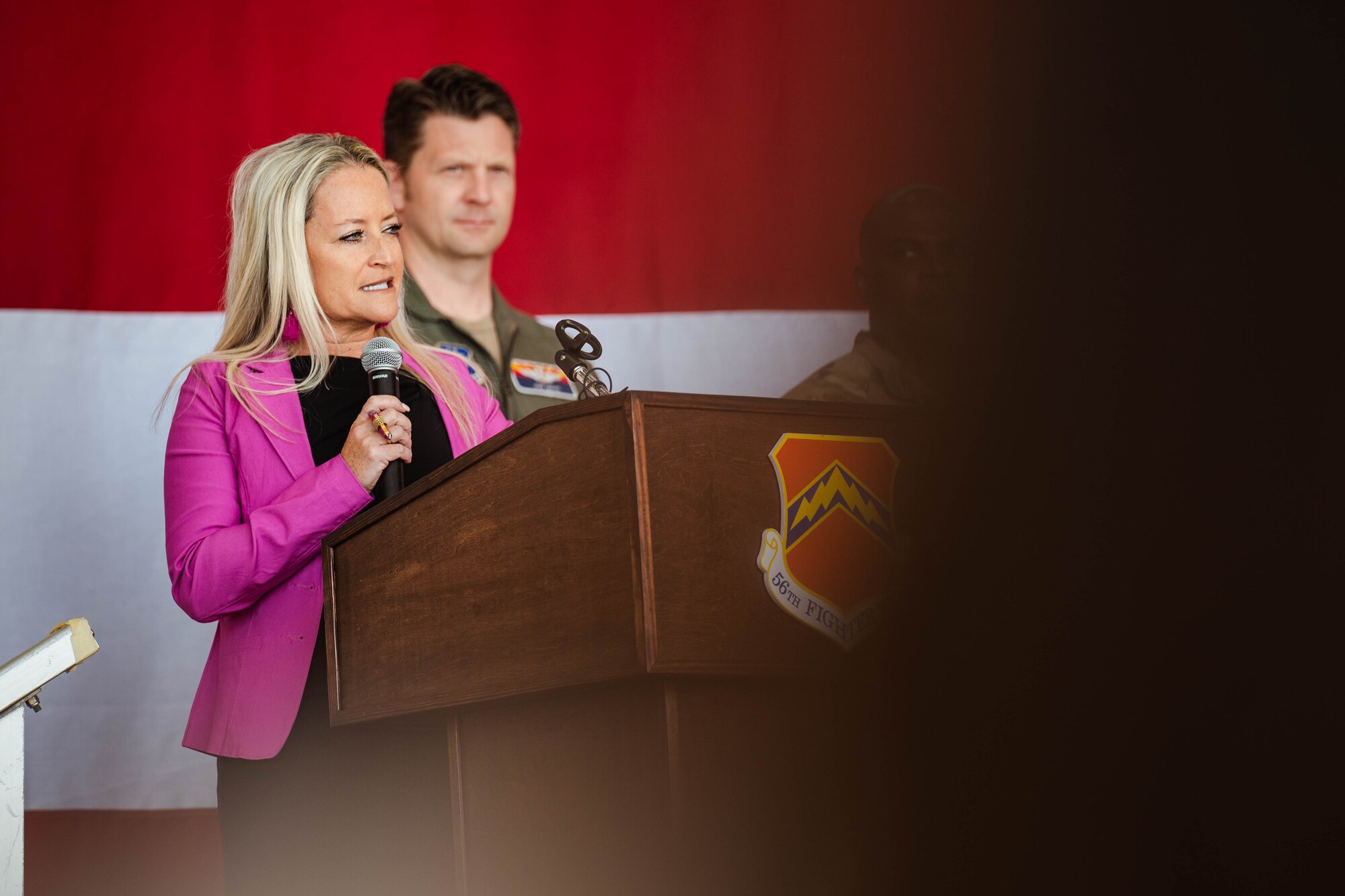 Melissa Rueschhoff, Arizona attorney and founder of Holon Law Partners and 56th Fighter Wing command spouse, speaks at the ceremonial signing of Arizona House Bill 2246.