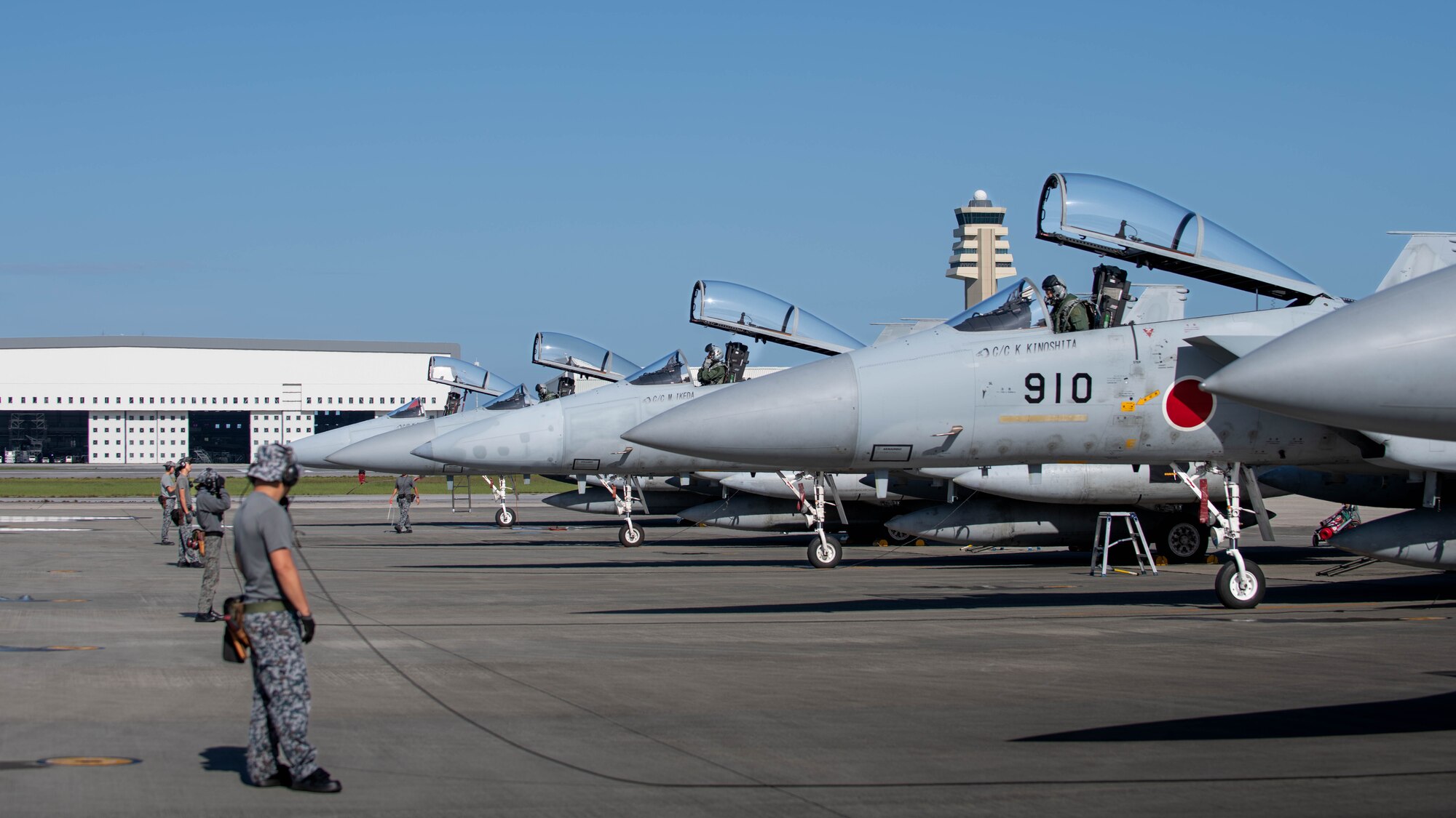 JASDF service members conduct pre-flight inspections.