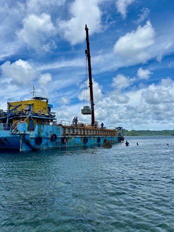 Personnel from U.S. Coast Guard Forces Micronesia/Sector Guam observe the installation of aids to navigation from the government of Japan in Palau on May 14, 2024. The team completed a vital weeklong mission in the Republic of Palau, setting the stage for future collaboration and bolstering safe maritime navigation and security. This visit, in response to a request from Palau Marine Transportation, focused on an Aids to Navigation (ATON) Subject Matter Expert Exchange (SMEE). (U.S. Coast Guard photo)