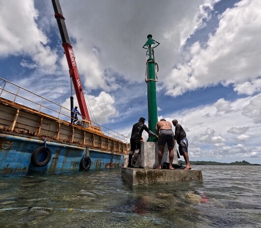 U.S. Coast Guard Forces Micronesia Sector Guam personnel and Marine Transportation leadership observe the installation of fixed ATON from the government of Japan being installed in Palau on May 14, 2024. The team completed a vital weeklong mission in the Republic of Palau, setting the stage for future collaboration and bolstering safe maritime navigation and security. This visit, in response to a request from Palau Marine Transportation, focused on an Aids to Navigation (ATON) Subject Matter Expert Exchange (SMEE). (U.S. Coast Guard photo)