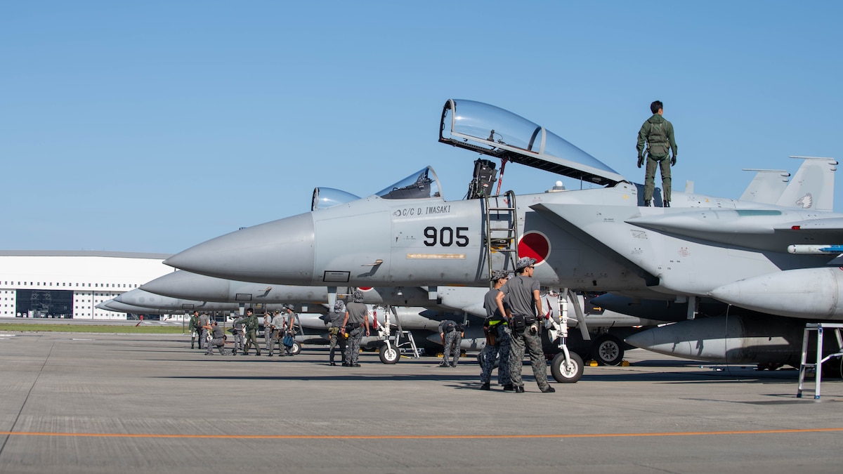 JASDF service members conduct pre-flight inspections.