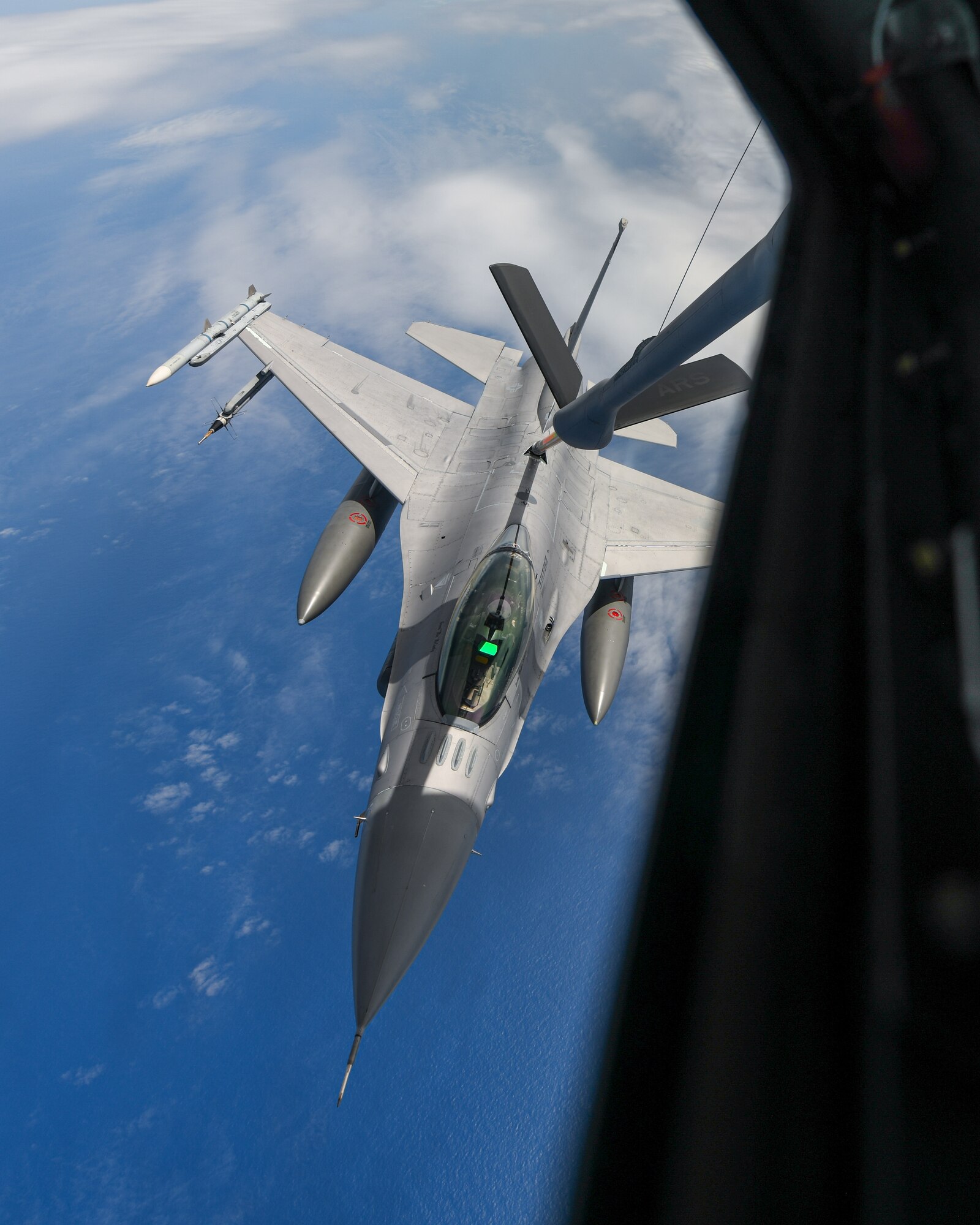 An F-16 conducts aerial refueling.