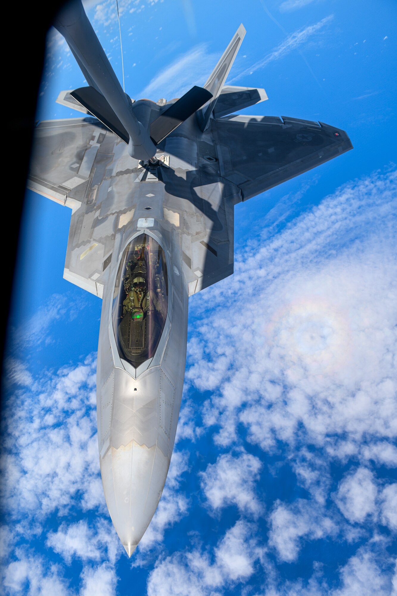An F-22A Raptor conducts aerial refueling.