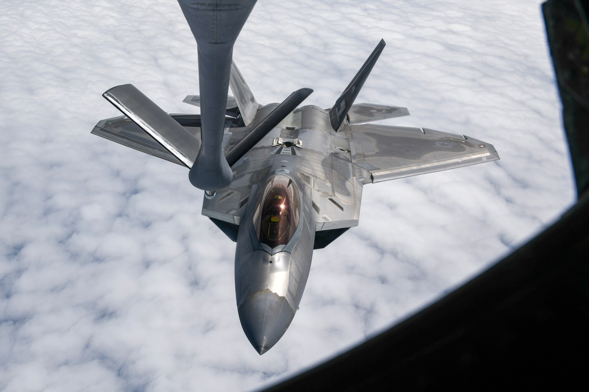 An F-22A Raptor prepares for aerial refueling.