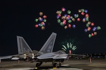 A U.S. Air Force F-22 Raptor assigned to the 199th Fighter Squadron sits on the flightline at Yokota Air Base, Japan, May 19, 2024 during the Japanese-American Friendship Festival fireworks display.