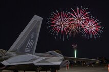 A U.S. Air Force F-22 Raptor assigned to the 199th Fighter Squadron sits on the flightline at Yokota Air Base, Japan, May 19, 2024 during the Japanese-American Friendship Festival fireworks display.