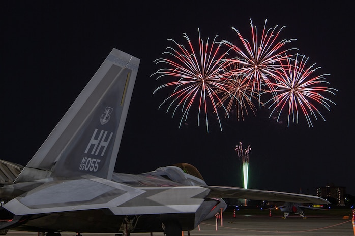 A U.S. Air Force F-22 Raptor assigned to the 199th Fighter Squadron sits on the flightline at Yokota Air Base, Japan, May 19, 2024 during the Japanese-American Friendship Festival fireworks display.