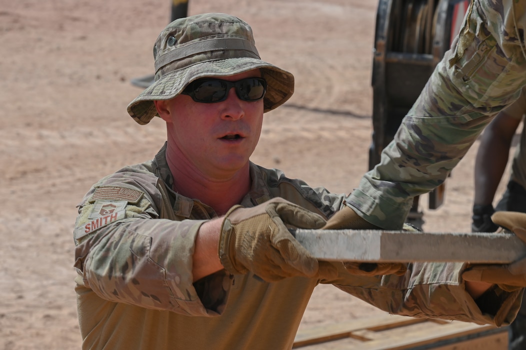 A U.S. Air Force senior enlisted leader
assigned to the 378th Expeditionary Logistics
Readiness Squadron installs a fuel bladder at
an undisclosed location within the U.S.
Central Command area of responsibility, May
17, 2024. Building this additional fuel
capacity will enable critical wing initiatives
such as hot pit refueling and agile combat
employment. (U.S. Air Force photo)