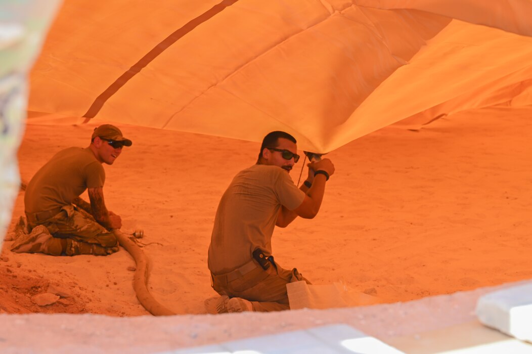U.S. Air Force Airmen assigned to the 378th
Air Expeditionary Wing secure a fuel bladder
liner at an undisclosed location within the
U.S. Central Command area of responsibility,
May 17, 2024. Fuel bladders provide the
flexibility for temporary or permanent use in
austere locations to refuel aircraft and fuel
trucks. (U.S. Air Force photo)