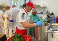 A U.S. Army Soldier and a Polish culinary specialist work together on a recipe during a recent culinary cross training event in Skwierzyna, Poland. “The result was a seamless blend of flavors and cultures, fostering mutual understanding and appreciation,” said Morgan Ridgway, the chief of supply and services at Logistics Readiness Center Poland. (U.S. Army courtesy photo)