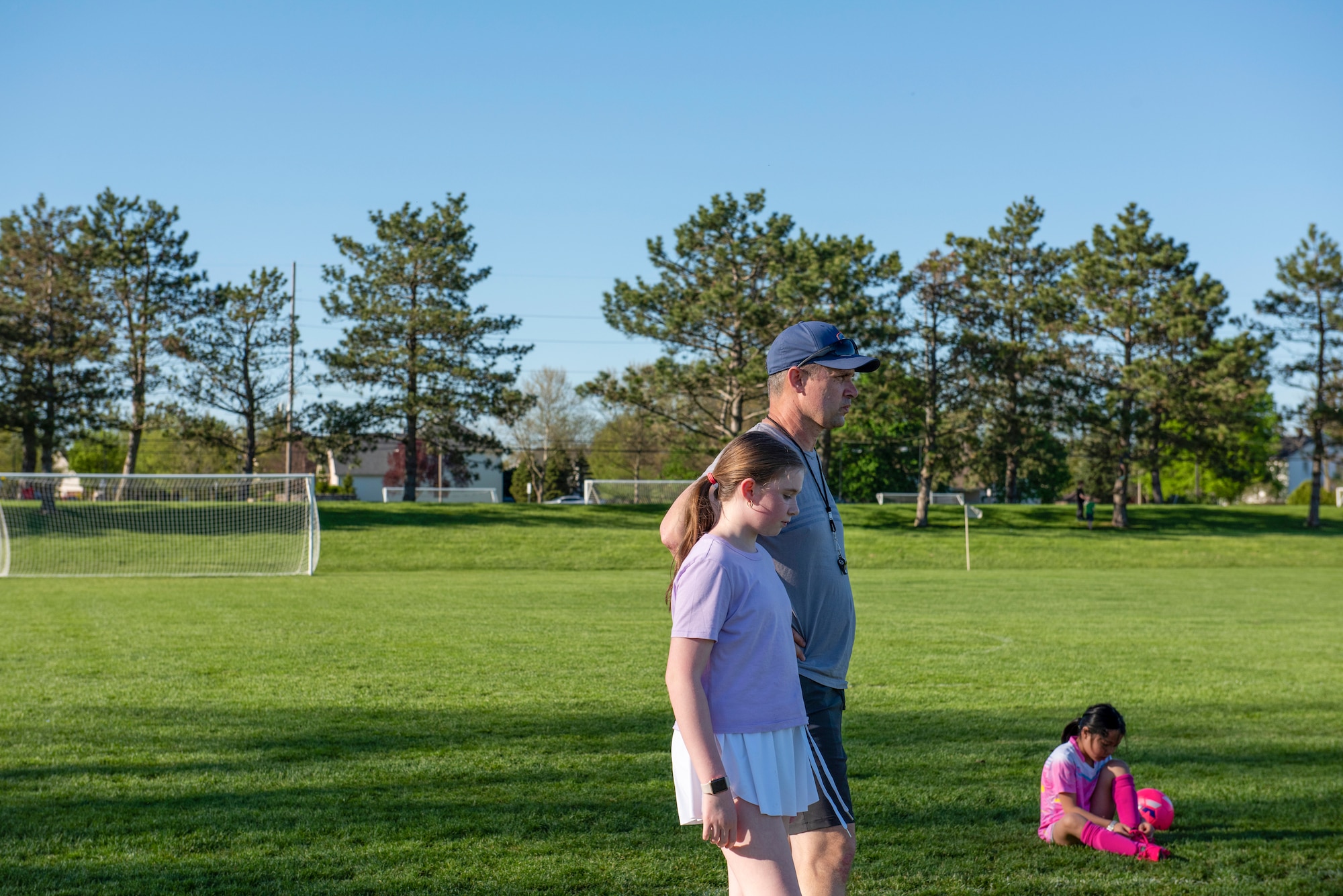 Man stands with his daughter