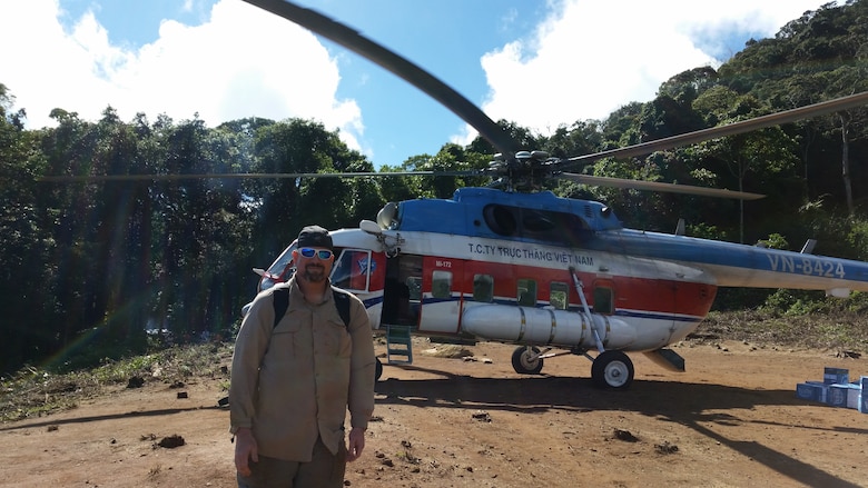 man with helicopter in Vietnam