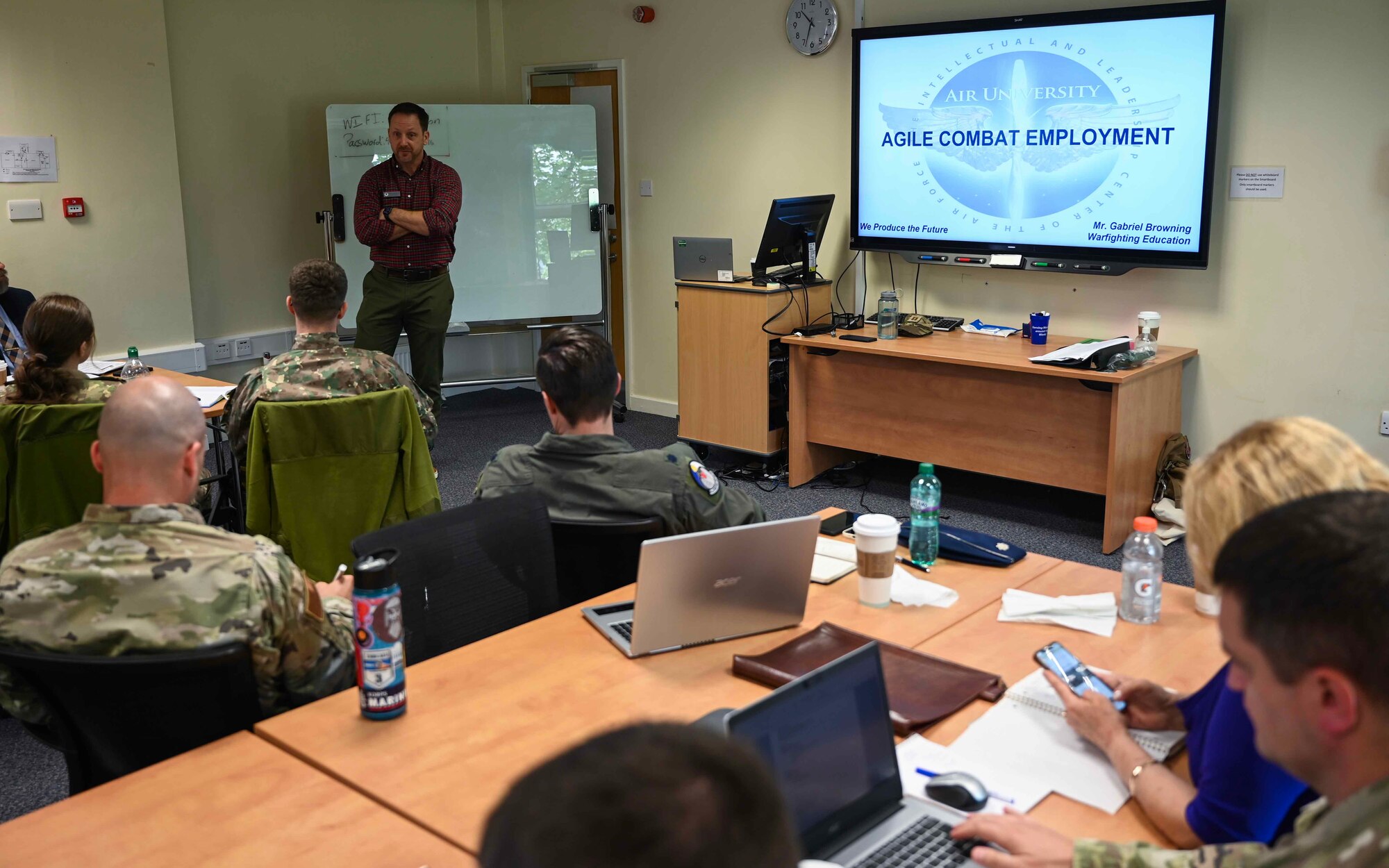 Gabriel Browning, U.S. Air Force warfighting instructor, speaks to participants during a Language Enable Airmen Postured for Agile Combat Employment training at Royal Air Force Mildenhall, England, May 6, 2024.