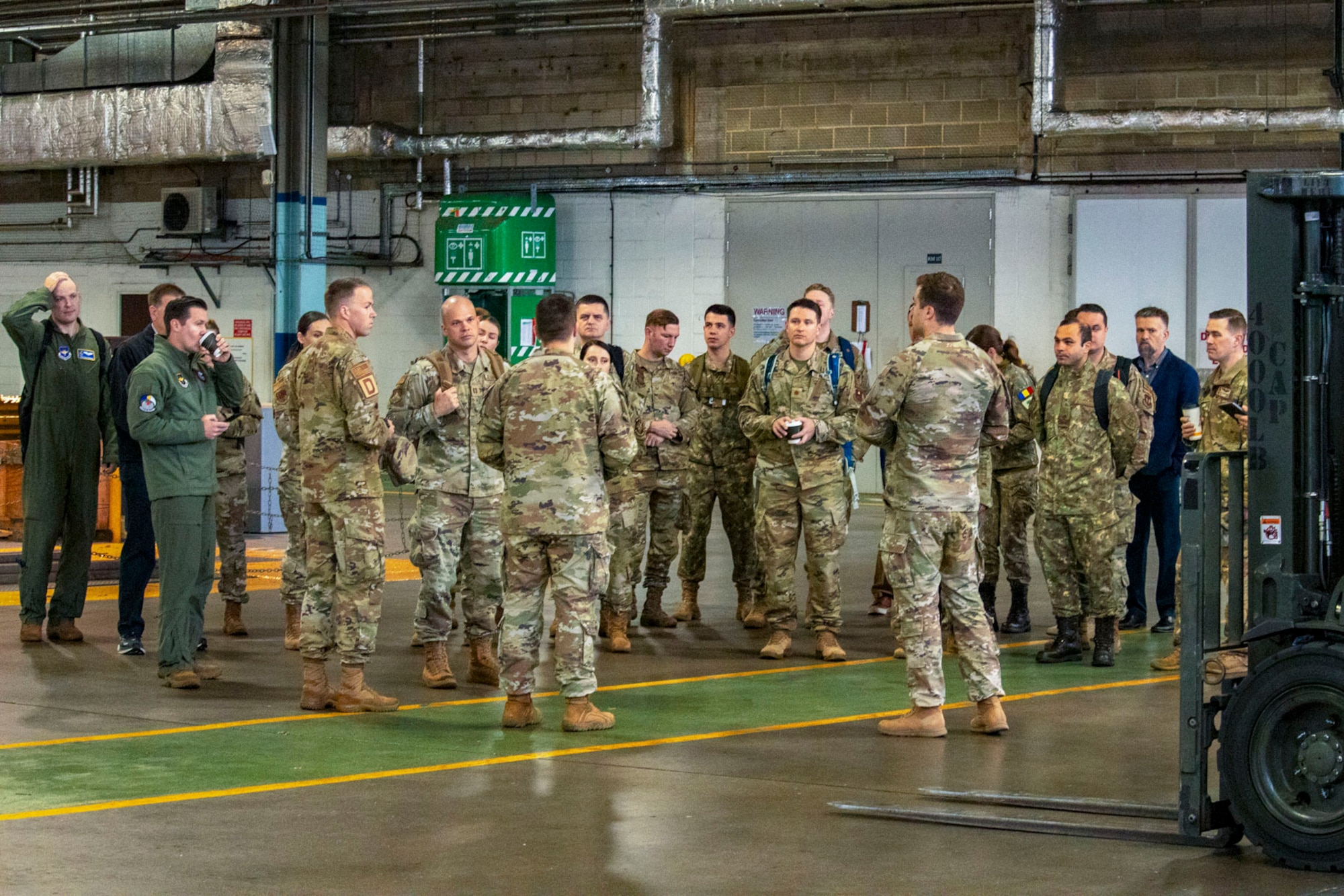 Participants in the Language Enabled Airmen Postured for Agile Combat Employment tour the 727th Air Mobility Squadron Traffic Management Office at Royal Air Force Mildenhall, England, May 8, 2024.