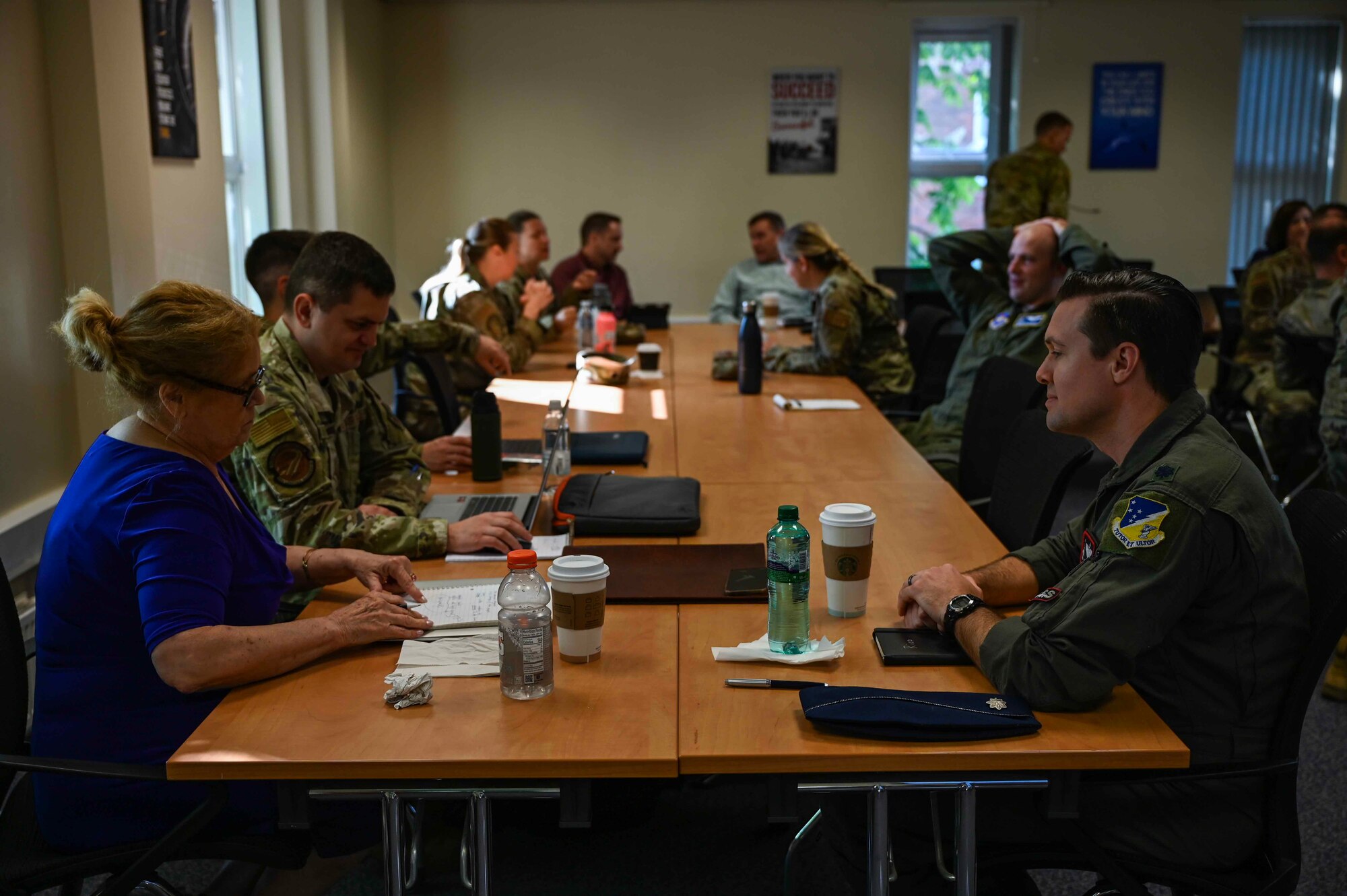U.S. and Romanian Airmen and civilian foreign language instructors discuss current events at a Language Enabled Airmen Postured for Agile Combat Employment training at Royal Air Force Mildenhall, England, May 6, 2024.
