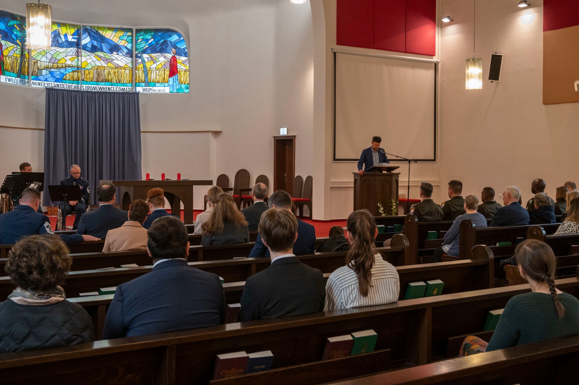 People in an audience watch a guest speaker