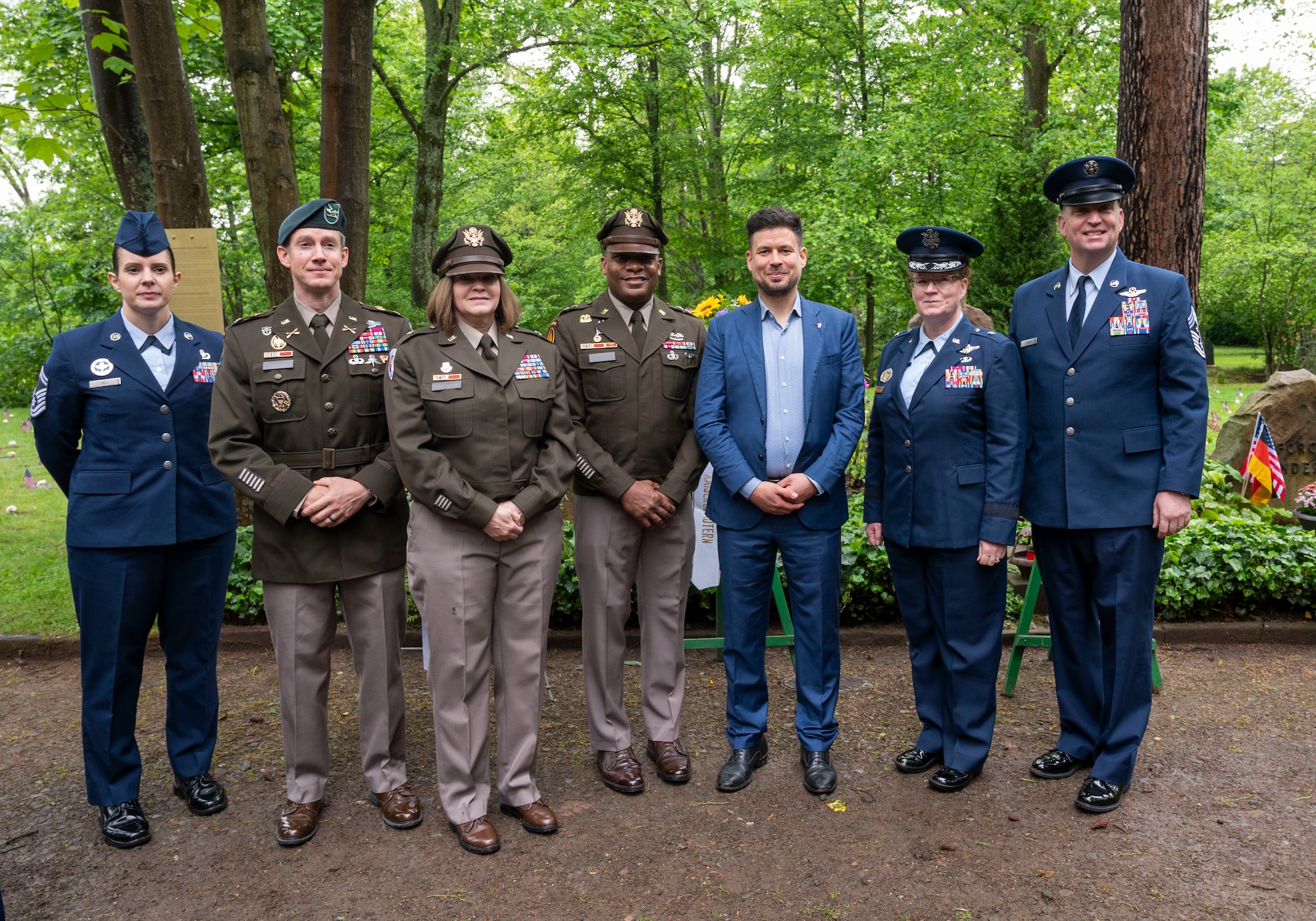 Seven people pose for a photo