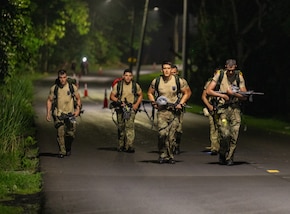 Paraguayan Team competitors run together while participating in a 20-kilometer Night Ruck March during the Fuerzas Comando 2024 (FC24) in Cerro Tigre, Panama, May 19, 2024.