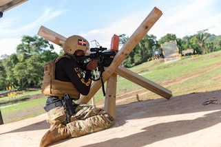 Dominican Republic Team competitor uses a fixed position to fire his rifle during the Fuerzas Comando 24 (FC24) Shooting and Skills Test in Cerro Tigre, Panama, May 17, 2024.