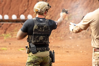 American Team competitor fires a pistol during the Assaulters Range portion of Fuerzas Comando 24 (FC24) Skills and Shooting Tests in Cerro Tigre, Panama, May 15, 2024.