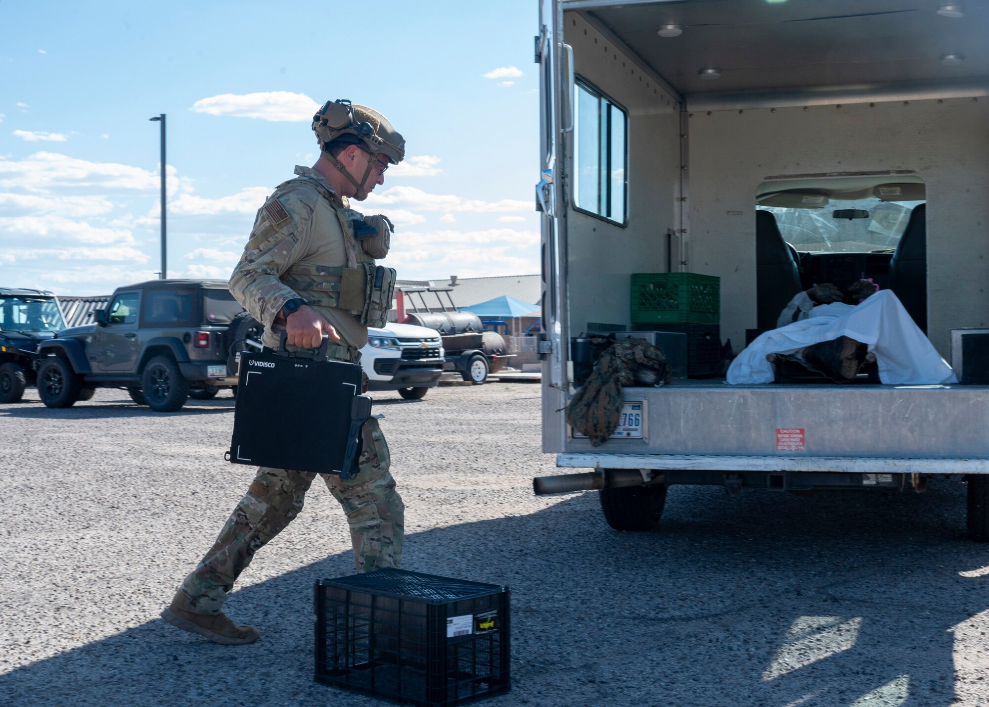 An Explosive Ordnance Disposal U.S. Airman assigned to the 355th Civil Engineering Squadron prepares to perform an X-ray on a simulated casualty during the Mission Support Group Phase II training exercise at Davis-Monthan Air Force Base, Ariz., May 13, 2024. The Airman X-rayed and removed a simulated improvised explosive device before passing the body over to 355th Force Support Squadron Airmen. (U.S. Air Force photo by Airman 1st Class William Finn V)