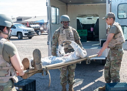 U.S. Airmen assigned to the 355th Force Support Squadron carry a simulated casualty during the Mission Support Group Phase II training exercise at Davis-Monthan Air Force Base, Ariz., May 13,
2024. The Airmen trained to be prepared for mission tasks that could occur in a contested environment. (U.S. Air Force photo by
Airman 1st Class William Finn V)