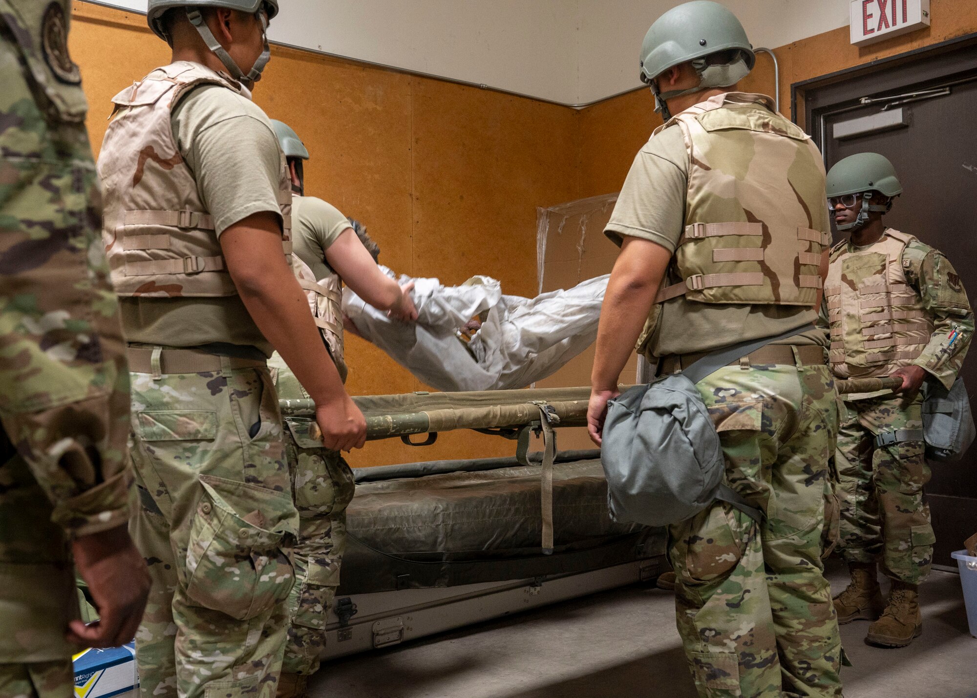U.S. Airmen assigned to the 355th Force Support Squadron store a simulated casualty during the Mission Support Group Phase II training exercise at Davis-Monthan Air Force Base, Ariz., May 13,
2024. The Airmen were required to correctly retrieve, store and document a simulated casualty. (U.S. Air Force photo by Airman 1st Class William Finn V)
