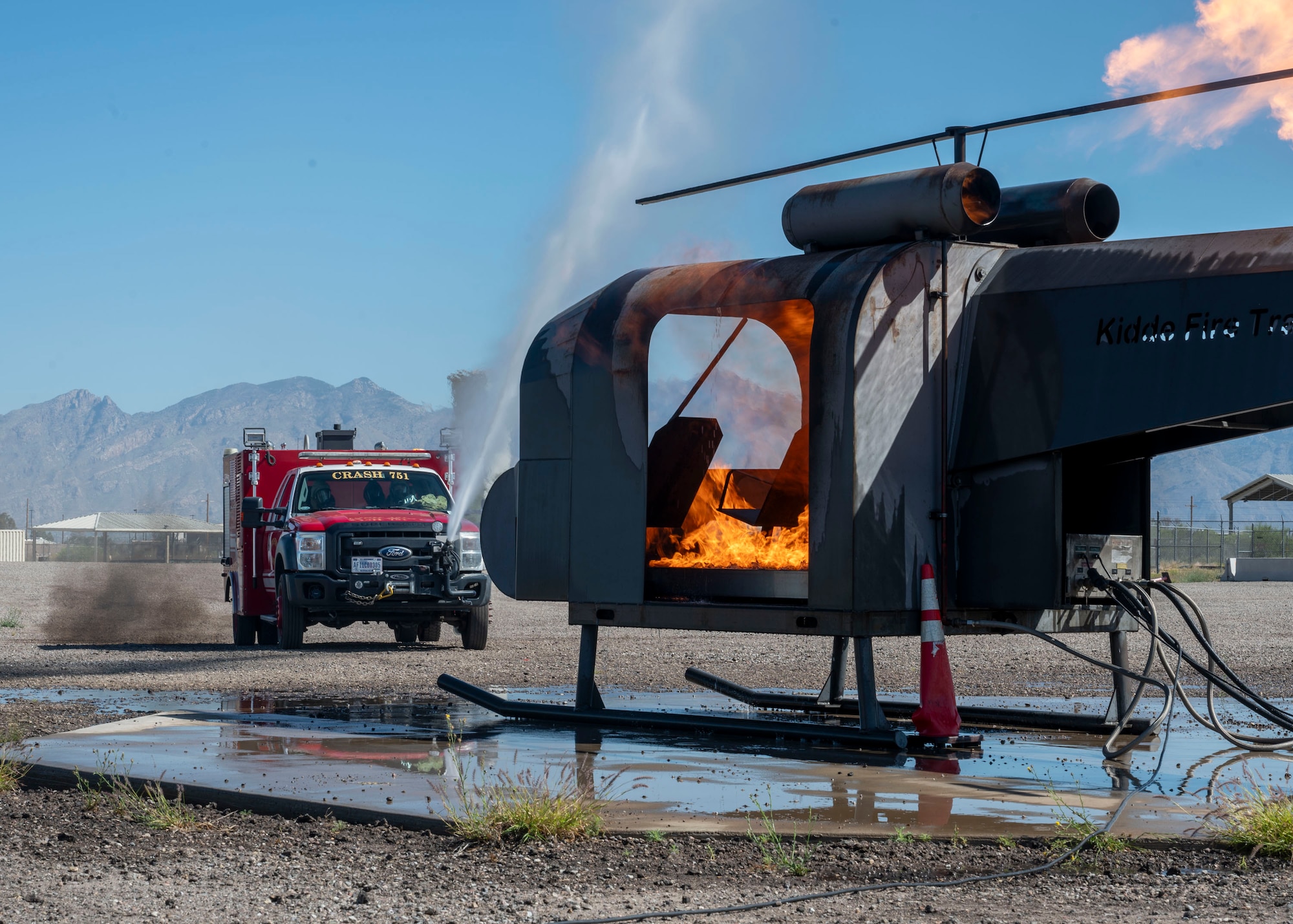U.S. Airmen assigned to the 355th Civil Engineering Squadron put out a simulated fire during the Mission Support Group Phase II
training exercise at Davis-Monthan Air Force Base, Ariz., May 13, 2024. Airmen regularly train to be prepared and proficient at their jobs. (U.S. Air Force photo by Airman 1st Class William Finn V)