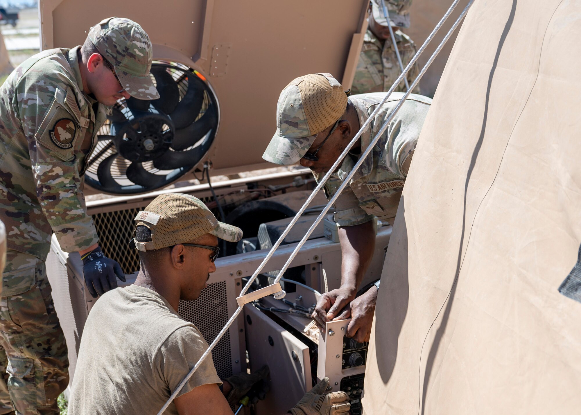 U.S. Airmen assigned to the 355th Civil Engineering Squadron work on an air conditioning unit during the Mission Support Group Phase II training exercise at Davis-Monthan Air Force Base, Ariz., May 13, 2024. Airmen participated in training scenarios to prepare for challenges they might face in a deployed environment. (U.S.
Air Force photo by Airman 1st Class William Finn V)