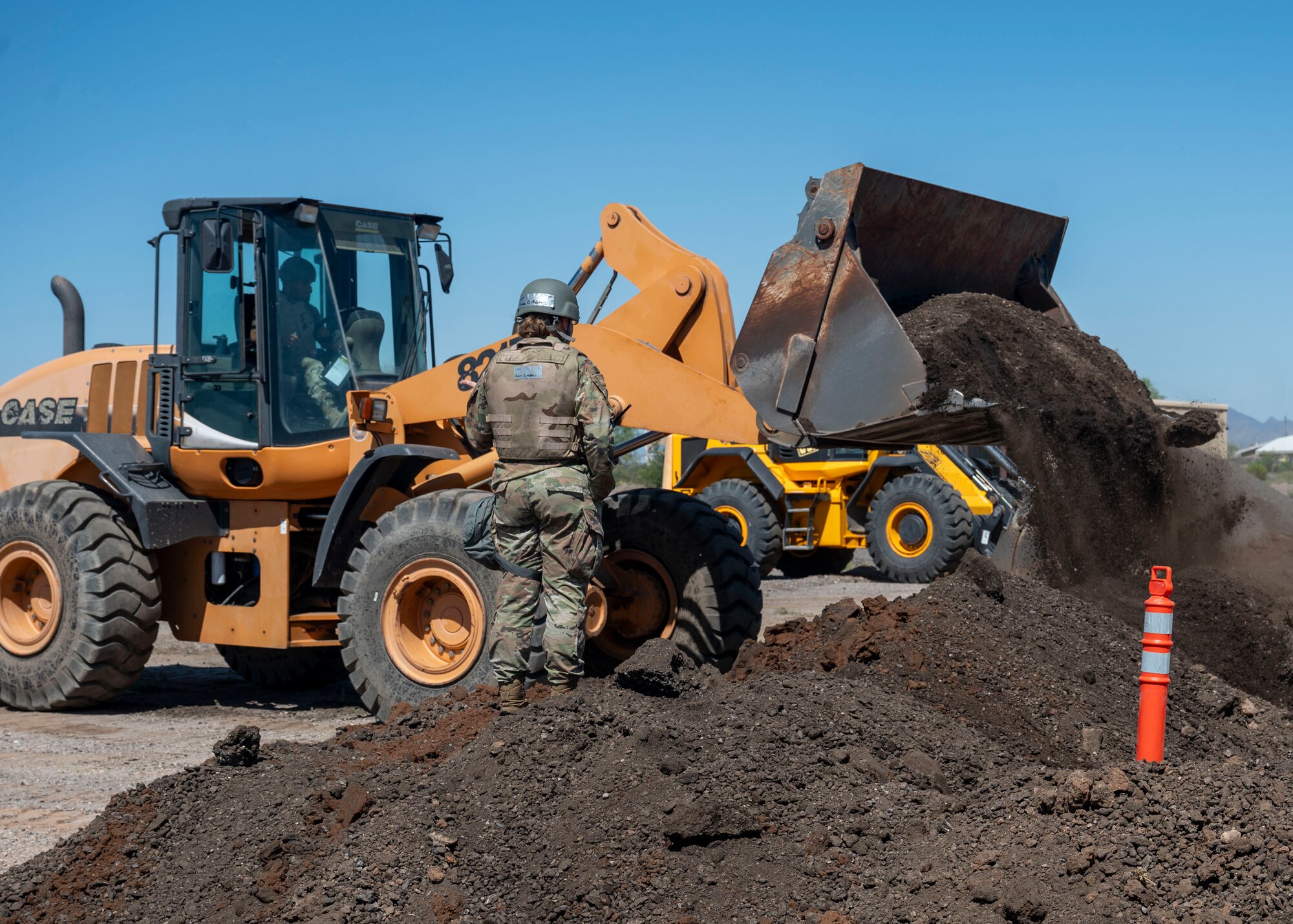 U.S. Airmen assigned to the 355th Civil Engineering Squadron build a dirt berm during the Mission Support Group Phase II training exercise at Davis-Monthan Air Force Base, Ariz., May 13,
2024. The MSG exercise provided vital training opportunities for Airmen in contested environments. (U.S. Air Force photo by Airman 1st Class William Finn V)