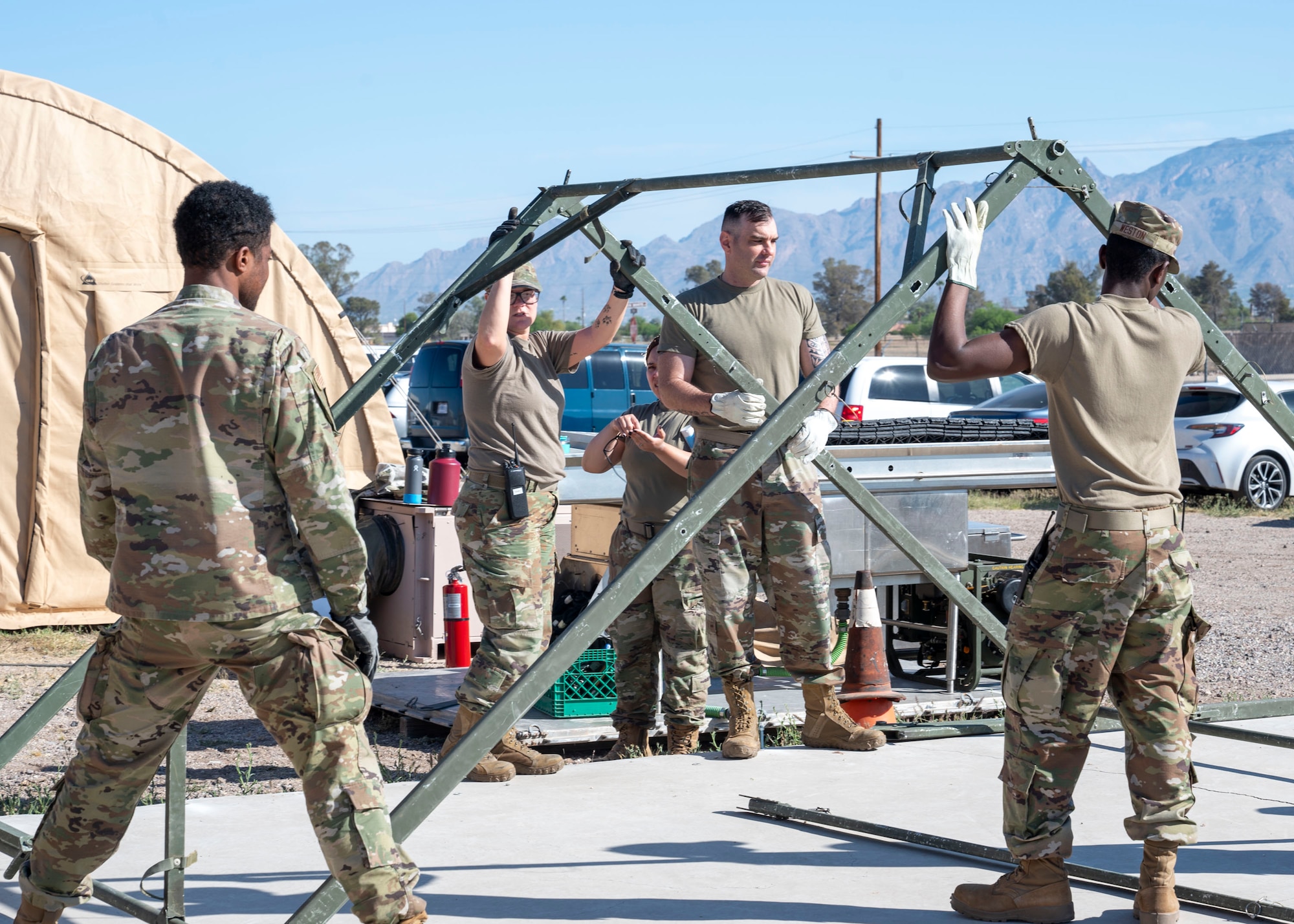 U.S. Airmen from the 355th Force Support Squadron assemble a structure during the Mission Support Group Phase II training
exercise at Davis-Monthan Air Force Base, Ariz., May 14, 2024. The MSG exercise provided vital training to prepare Airmen to operate in contested environments. (U.S. Air Force photo by
Airman 1st Class William Finn V)
