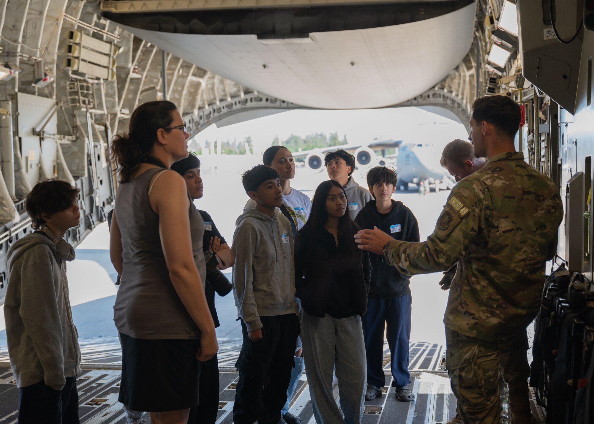 Spanaway Middle School students toured a C-17 Globemaster III and various locations around Joint Base Lewis-McChord, Washington, May 14, 2024. The students met with 62d Airlift Wing Airmen and were introduced to various aviation career fields to experience the rapid global mobility mission first-hand.