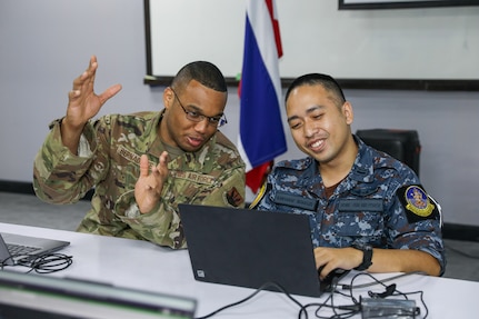 Army Gen. Daniel Hokanson, chief, National Guard Bureau, joins Army Maj. Gen. Bret Daugherty, Washington's adjutant general, to visit Washington National Guardsmen and Royal Thai Air Force members training together during exercise Enduring Partners 2024, Bangkok, Thailand, May 9, 2024.