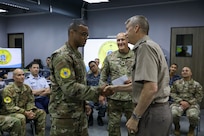 Army Gen. Daniel Hokanson, chief, National Guard Bureau, joins Army Maj. Gen. Bret Daugherty, Washington's adjutant general, to visit Washington National Guardsmen and Royal Thai Air Force members training together during exercise Enduring Partners 2024, Bangkok, Thailand, May 9, 2024.
