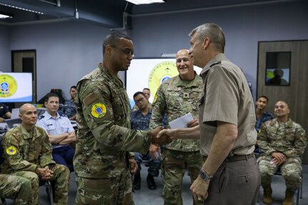 Army Gen. Daniel Hokanson, chief, National Guard Bureau, joins Army Maj. Gen. Bret Daugherty, Washington's adjutant general, to visit Washington National Guardsmen and Royal Thai Air Force members training together during exercise Enduring Partners 2024, Bangkok, Thailand, May 9, 2024.