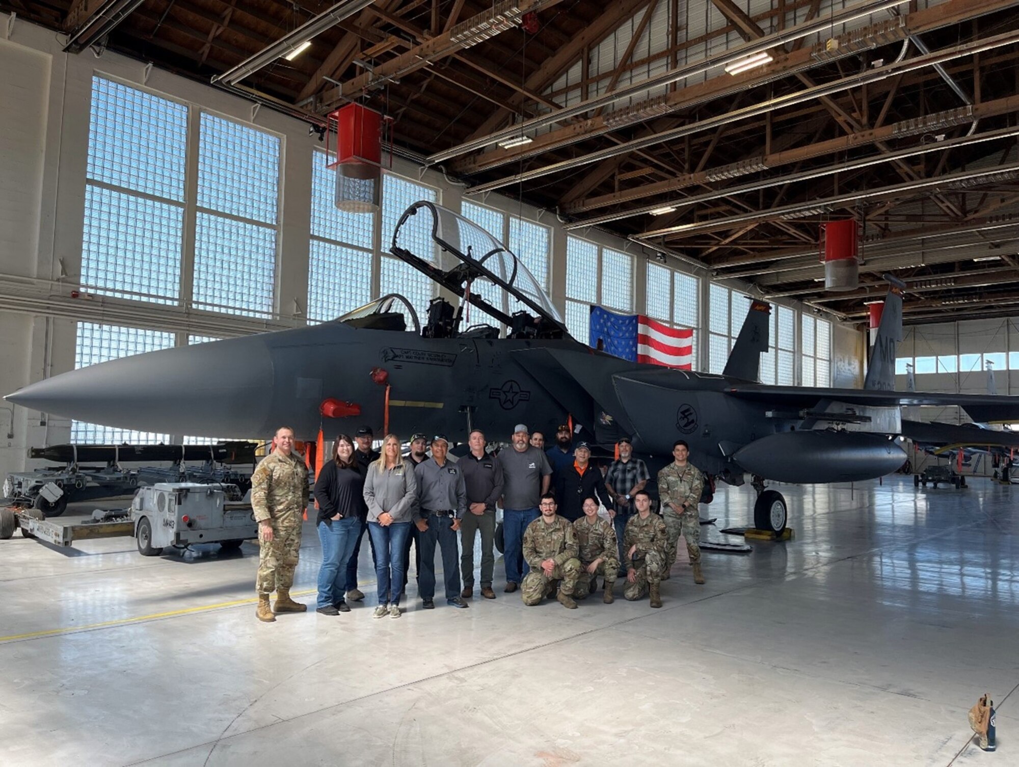 Photo of Airmen and state leaders standing together