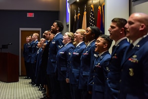 Airman Leadership School Class 24-D graduates sing “The U.S. Air Force” at the end of their graduation ceremony at the Powell Event Center, Goodfellow Air Force Base, Texas, May 17, 2024. “The U.S. Air Force” is the official song of the United States Air Force. (U.S. Marine Corps photo by Corporal Jessica Roeder)