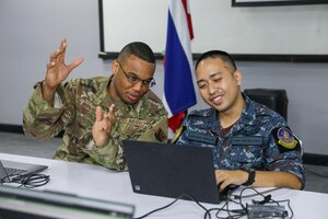 Army Gen. Daniel Hokanson, chief, National Guard Bureau, joins Army Maj. Gen. Bret Daugherty, Washington's adjutant general, to visit Washington National Guardsmen and Royal Thai Air Force members training together during exercise Enduring Partners 2024, Bangkok, Thailand, May 9, 2024.