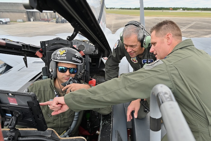 U.S. Air Force Gen. Ken Wilsbach, commander of Air Combat Command, watches a live cockpit demonstration of a long-range kill chain solution led by Lt. Col. Jacob Lindaman, 53rd Wing, A3X director, and Maj. Matthew Sowder, 85th Test and Evaluation Squadron, operations chief, at Eglin Air Force Base, Florida, April 11, 2024. The 53rd Wing is committed to rapidly advancing capabilities of our current tactical forces. (U.S. Air Force photo by Capt. Lindsey Brewer)