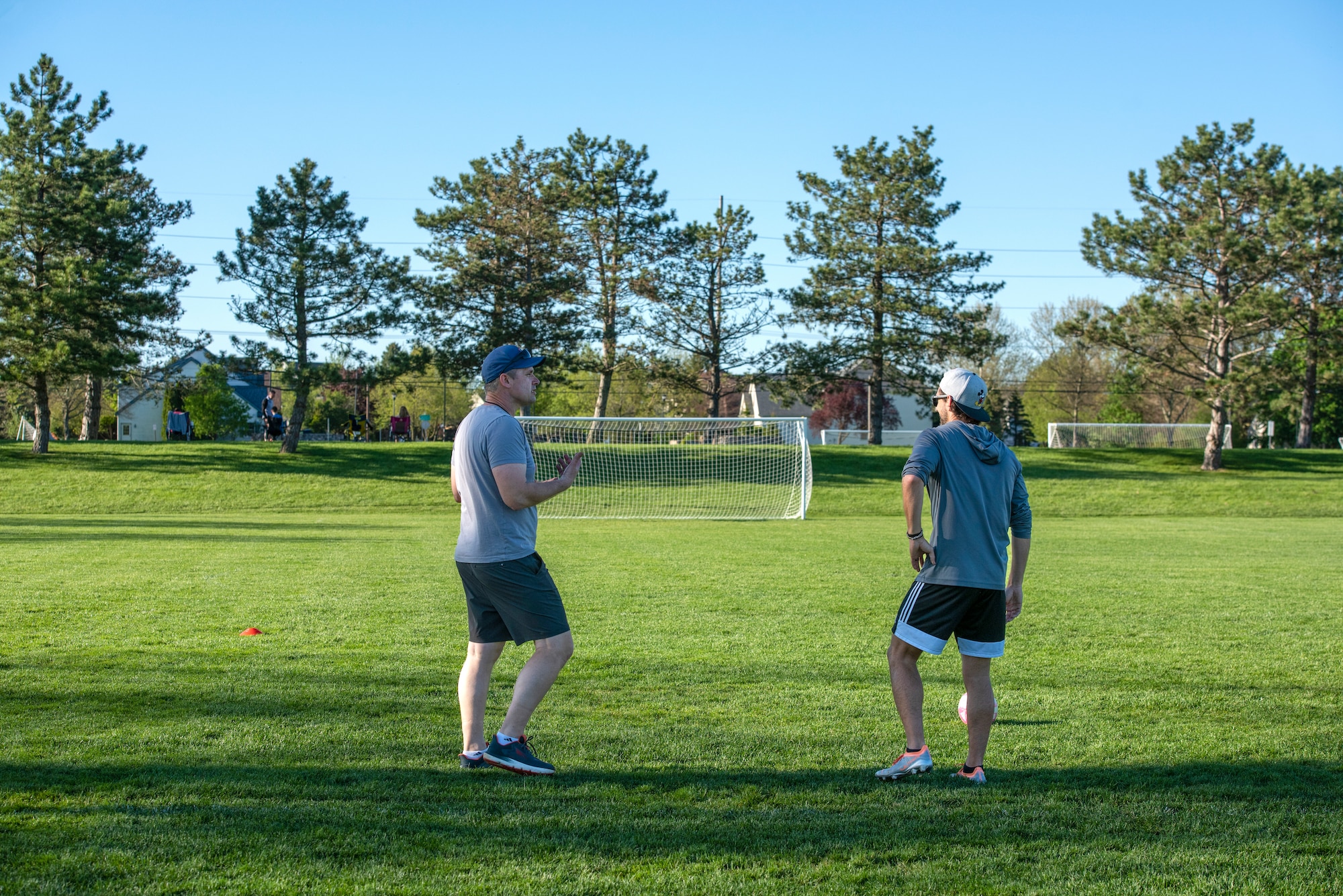 Two coaches talk to each other.