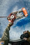 A U.S. Coast Guard Air Station Clearwater MH-60 Jayhawk aircrew hoists a man from a disabled adrift vessel near Samana Cay, Bahamas, May 20, 2024. The individual was promptly given electrolytes and water and reported in good health. (U.S. Coast Guard photo by Lt. Scott Kellerman)