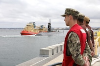 240520-N-QG393-1033 SAN DIEGO (May 20, 2024) Sailors assigned to Commander Submarine Squadron 11 prepare to moor the Los-Angeles class fast-attack submarine USS Greeneville (SSN 772) as it arrives at its new homeport at Naval Base Point Loma following a 30 month Engineered Overhaul at Portsmouth Naval Shipyard in Kittery, Maine. Greeneville will be joining the four submarines already assigned to Submarine Squadron 11. (U.S. Navy photo by Mass Communication Specialist 1st Class Tiarra N. Brown)