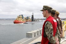 240520-N-QG393-1033 SAN DIEGO (May 20, 2024) Sailors assigned to Commander Submarine Squadron 11 prepare to moor the Los-Angeles class fast-attack submarine USS Greeneville (SSN 772) as it arrives at its new homeport at Naval Base Point Loma following a 30 month Engineered Overhaul at Portsmouth Naval Shipyard in Kittery, Maine. Greeneville will be joining the four submarines already assigned to Submarine Squadron 11. (U.S. Navy photo by Mass Communication Specialist 1st Class Tiarra N. Brown)