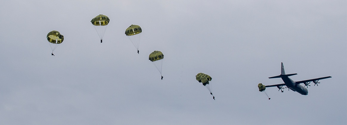Japan Ground Self-Defense Force paratroopers with the 1st Airborne Brigade conduct a static-line jump from a U.S. Air Force C-130J Super Hercules
