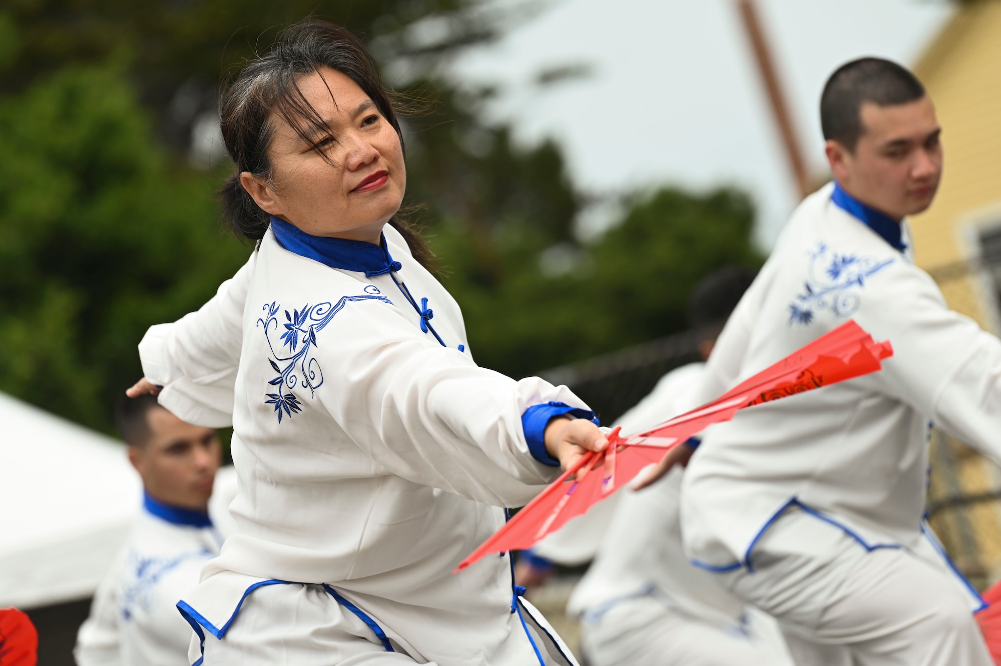 Students assigned to the 517th Training Group perform a Chinese Tachi Sword and Fan Dance during Language Day at the Defense Language Institute Foreign Language Center, Presidio of Monterey, California, May 17, 2024. Language Day emphasizes that language development is more than just mastering vocabulary and grammar; it is a key to understanding and connecting with diverse cultures around the world. (U.S. Air Force photo by Airman 1st Class Madison Collier)