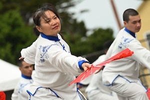 Students assigned to the 517th Training Group perform a Chinese Tachi Sword and Fan Dance during Language Day at the Defense Language Institute Foreign Language Center, Presidio of Monterey, California, May 17, 2024. Language Day emphasizes that language development is more than just mastering vocabulary and grammar; it is a key to understanding and connecting with diverse cultures around the world. (U.S. Air Force photo by Airman 1st Class Madison Collier)