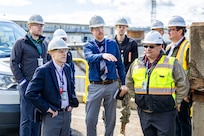 Dave Sweet, director, Shipyard Infrastructure Optimization Program, Program Management Office 555, leads Mark Edelson, Program Executive Officer for the U.S. Navy's Shipyard Infrastructure Optimization Program, on a tour of Dry Dock 6, May 6, 2024, during a visit to Puget Sound Naval Shipyard & Intermediate Maintenance Facility in Bremerton, Washington. (U.S. Navy photo by Jeb Fach)