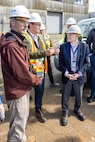 Erik Neal, senior vice president, WSP Maritime Division, briefs Mark Edelson, Program Executive Officer for the U.S. Navy's Shipyard Infrastructure Optimization Program, May 6, 2024, during a tour of Dry Dock 6 at Puget Sound Naval Shipyard & Intermediate Maintenance Facility in Bremerton, Washington. (U.S. Navy photo by Jeb Fach)