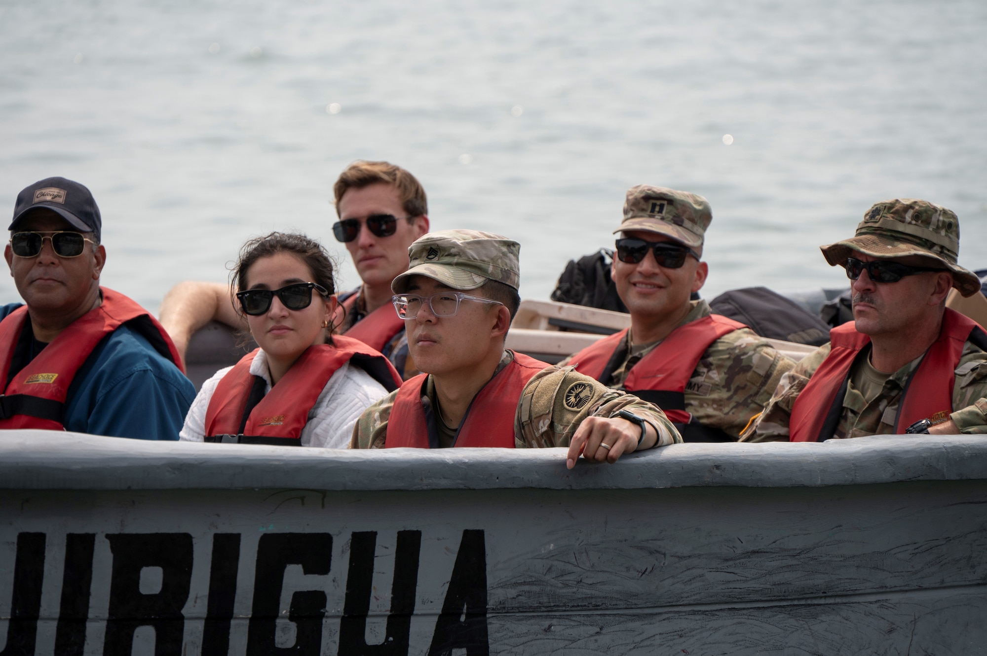 A photo of personnel in a boat.